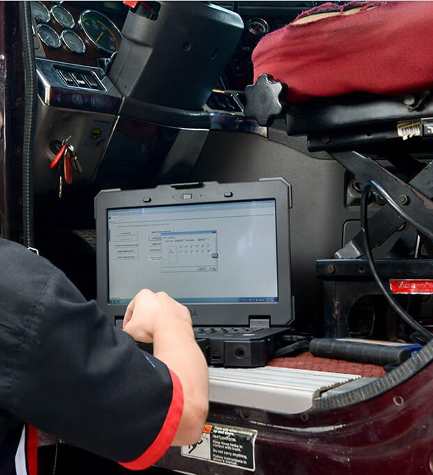 ECU Programming laptop on diesel truck